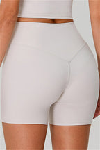 Fitglutes activewear one-shoulder crop top and high-waisted shorts 2-piece set, perfect for gym and workout attire.