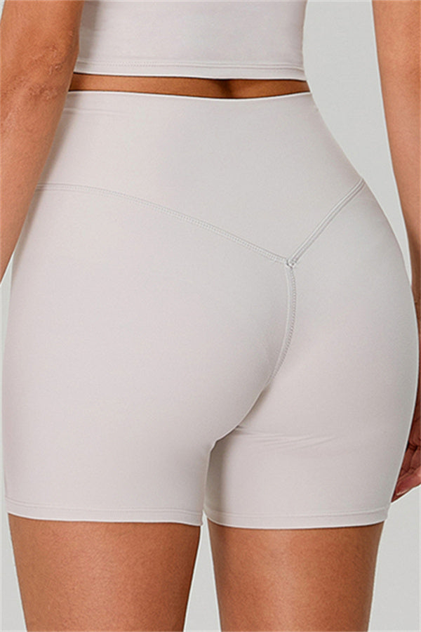 Fitglutes activewear one-shoulder crop top and high-waisted shorts 2-piece set, perfect for gym and workout attire.