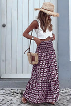 Geometric print smocked waist maxi dress by Plush Fashion Hub, featuring a flowy silhouette and stylish design.