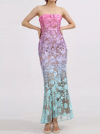 Floral embroidered tube maxi dress by Shopimist featuring a fitted bodice and flowing skirt with colorful floral embroidery.