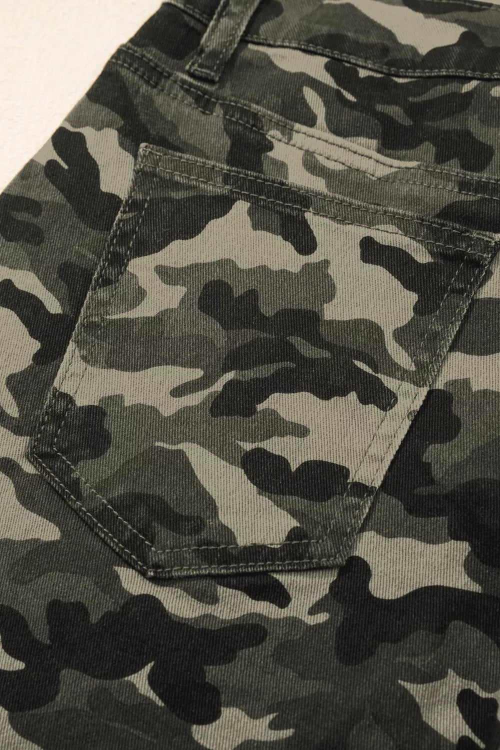 Camouflage print women's denim pants with multiple pockets from Shopimist, featuring a stylish, casual design.