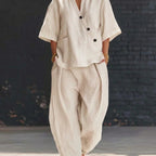 Plush Fashion Hub V-neck short sleeve top and high-waist trousers two-piece set, stylish casual outfit for women.