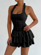Plush Fashion Hub halter neck ruffle layered dress with flowing fabric and stylish design, perfect for summer or special occasions.