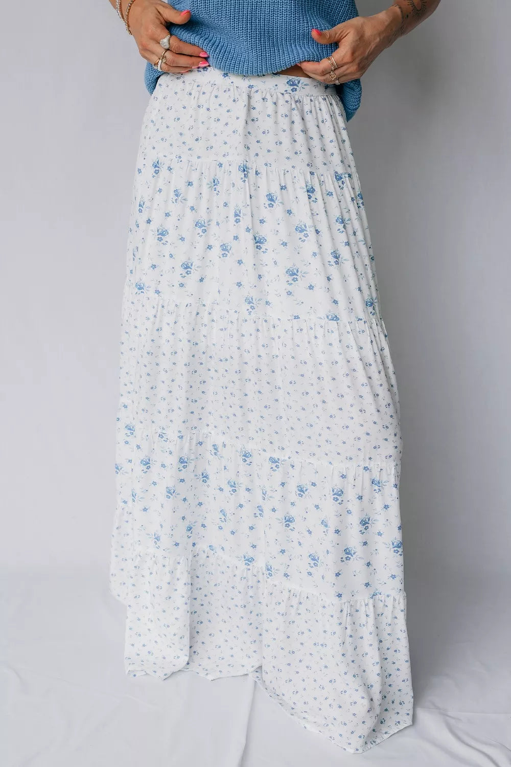 Women's high waisted floral boho maxi skirt with flowy tiers and viscose fabric, featuring a vibrant floral pattern.