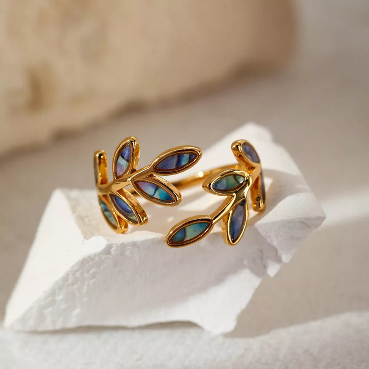 18K gold-plated resin leaf bypass ring with detailed leaf design, showcasing elegant jewelry craftsmanship.