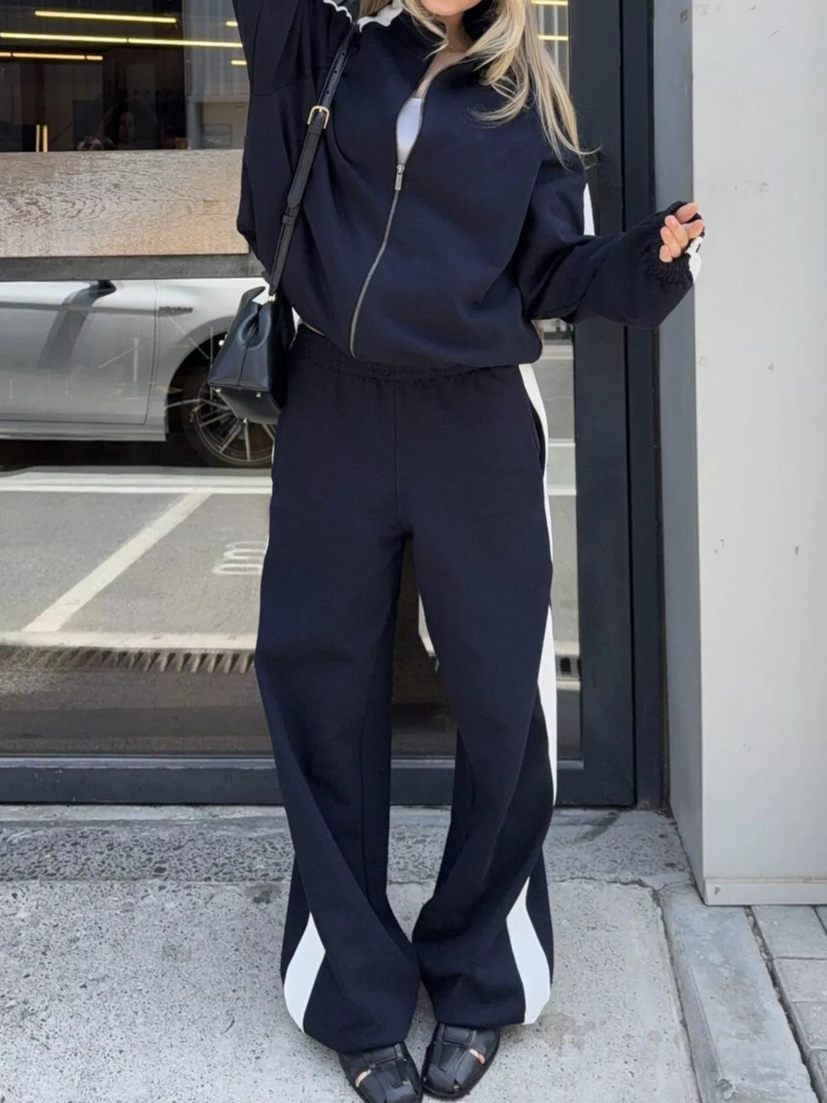 Plush Fashion Hub zip-up long sleeve tracksuit set with comfortable fabric, featuring a fitted design and stylish details.