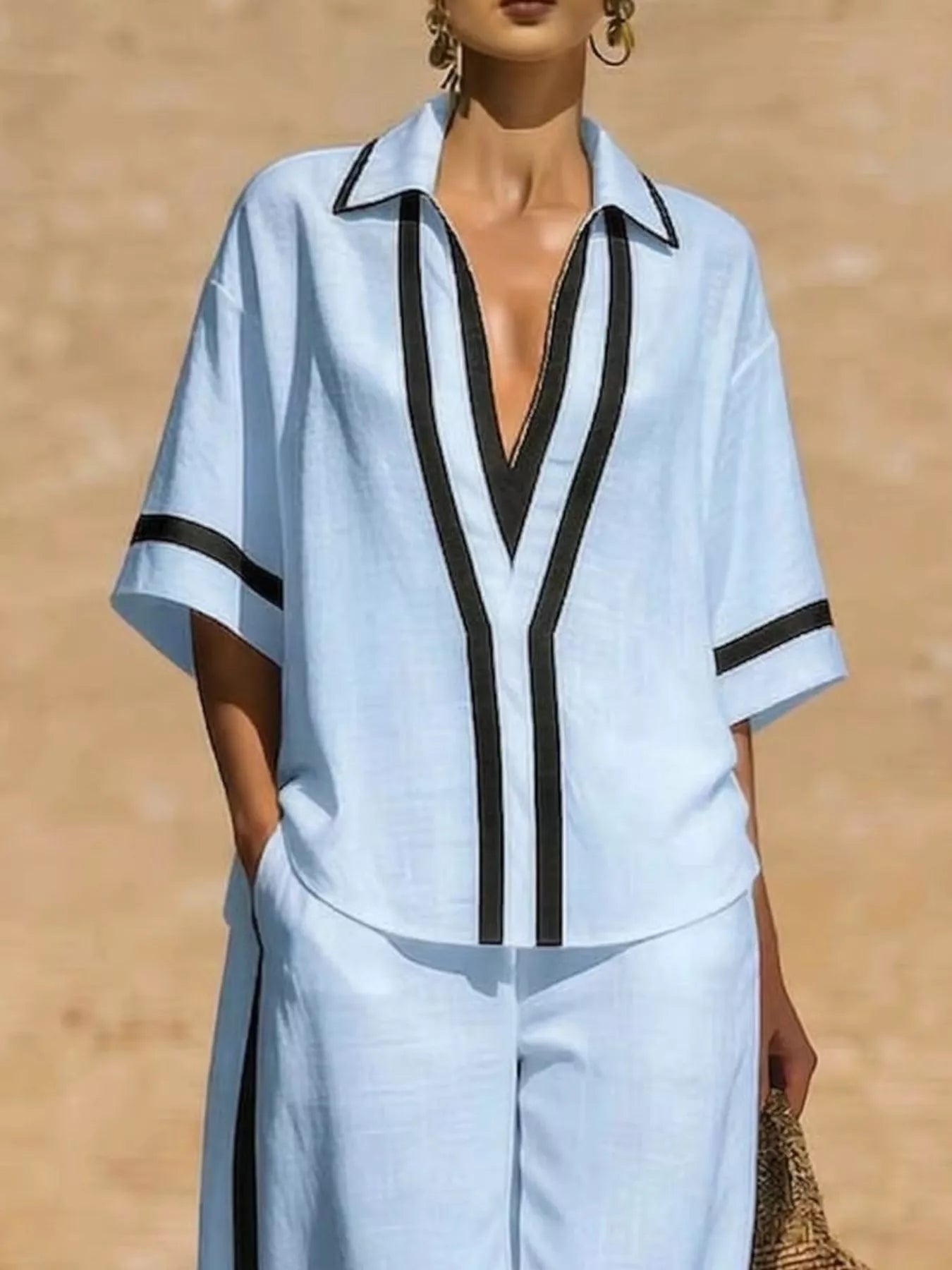 Plus size full contrast trim top and pants set from Trendsi, featuring a coordinated matching outfit with stylish details.