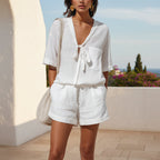 Women's lace-up short-sleeve shirt and loose shorts set by Plush Fashion Hub, casual summer co-ord, featuring lightweight fabric and relaxed fit.