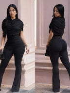 Ruched flare-leg jumpsuit from Trendsi featuring a fitted bodice and flowing wide-leg pants, perfect for stylish occasions.