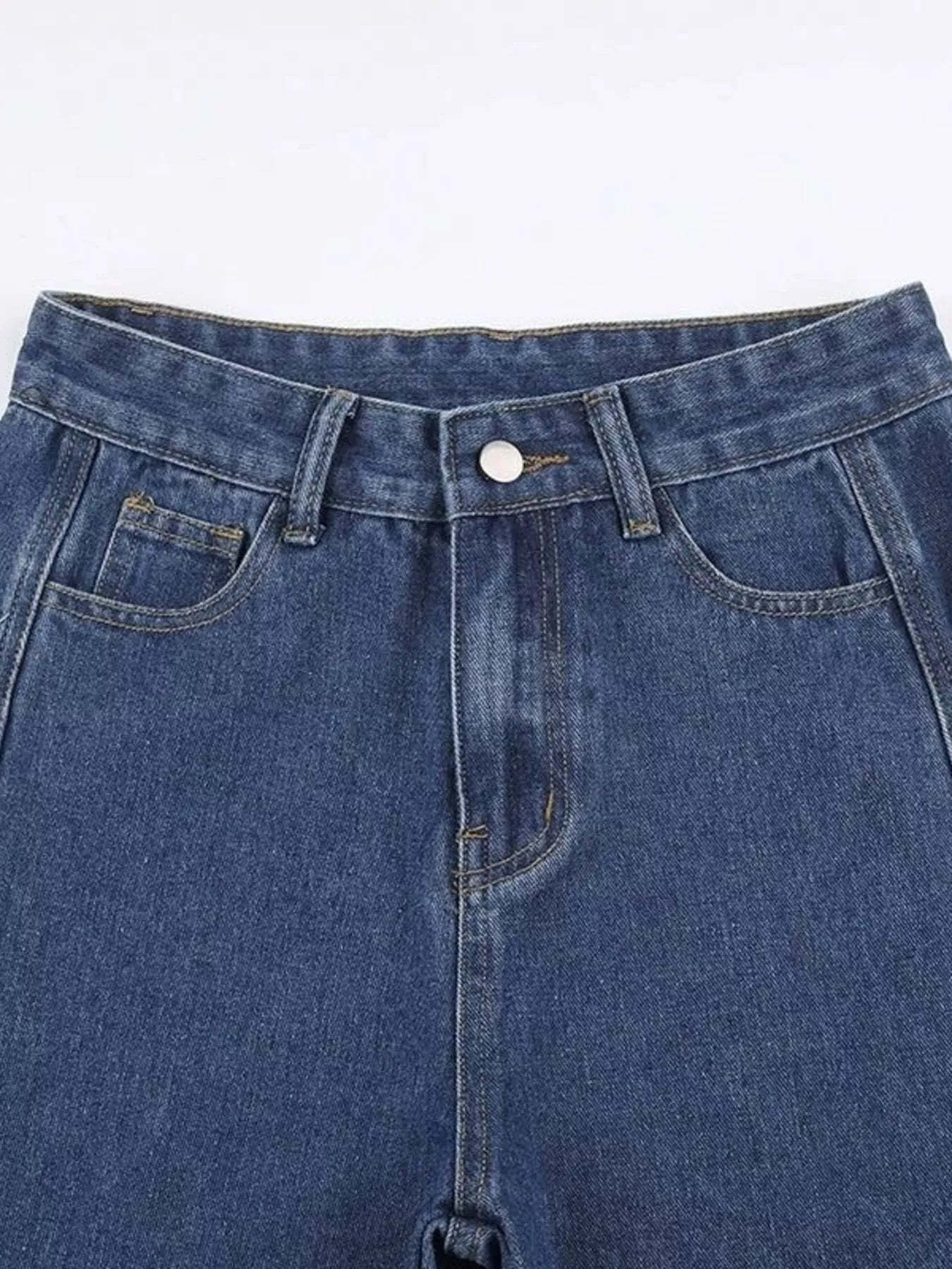 Plush Fashion Hub side distressed denim jeans with ripped details and a slim fit, showcasing the stylish denim design.