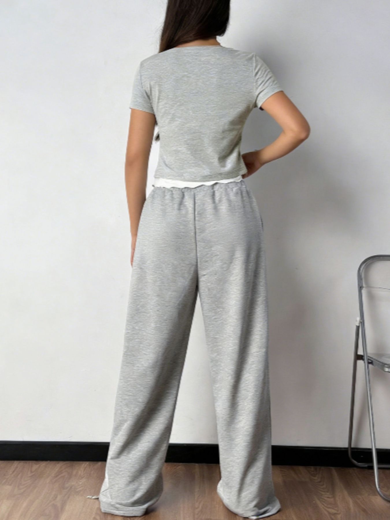 Plush Fashion Hub tie front short sleeve top and matching pants two-piece set displayed on a hanger.