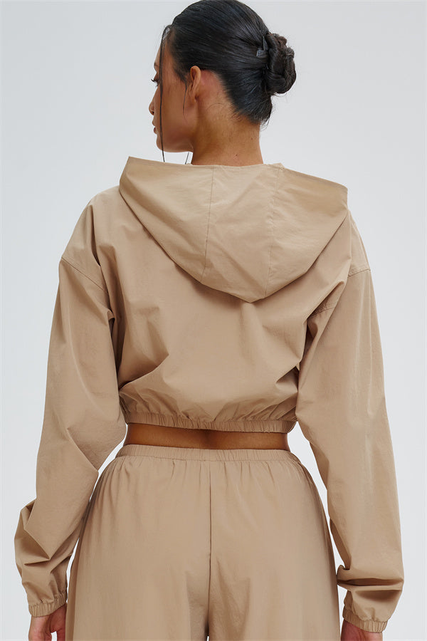 Svelte UV protection crop hoodie by Fitglutes Activewear, featuring a fitted design and breathable fabric for active workouts.