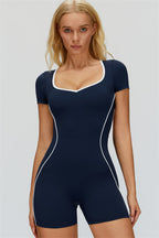 Fitglutes Activewear The Whisper Romper in black, close-up of the stylish, fitted workout romper with scoop neckline and seamless design.