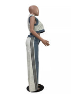 Zip front crop top and striped pants set by Shopimist, featuring a stylish crop top with a zipper and matching striped pants.