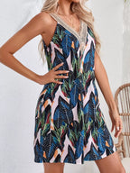 Tropical leaf print V-neck sleeveless dress by Shopimist, featuring vibrant green foliage on lightweight fabric.