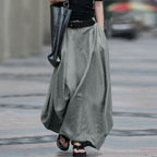 Women's high-waist flared maxi skirt in solid cotton linen with pockets, stylish and comfortable from Plush Fashion Hub.