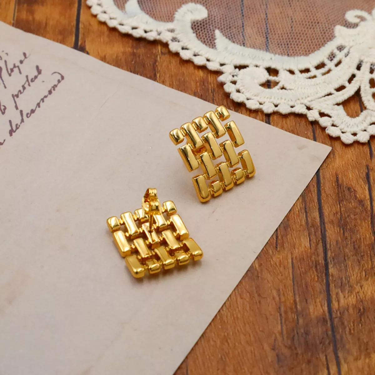 18K gold-plated geometric stud earrings with modern design, featuring sleek angular shapes and a polished finish.