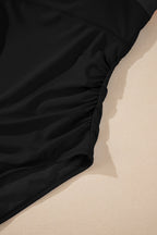 Threaded Pear Rowan Straps one-piece swimsuit featuring stylish straps and a sleek design, perfect for beach or poolside wear.