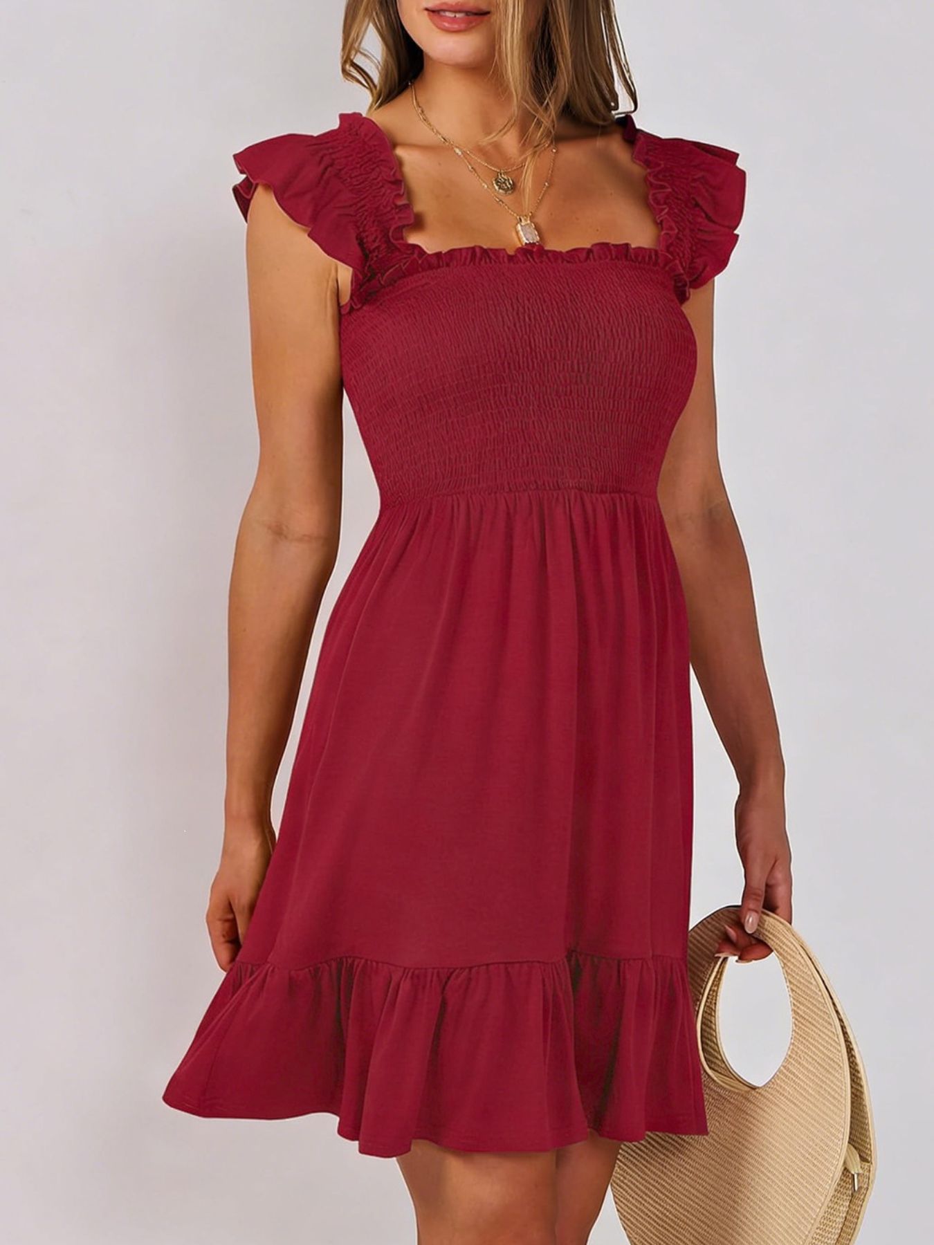 Women's smocked ruffle hem mini dress by Trendsi, casual lightweight summer dress with a breezy, relaxed fit and stylish ruffle details.