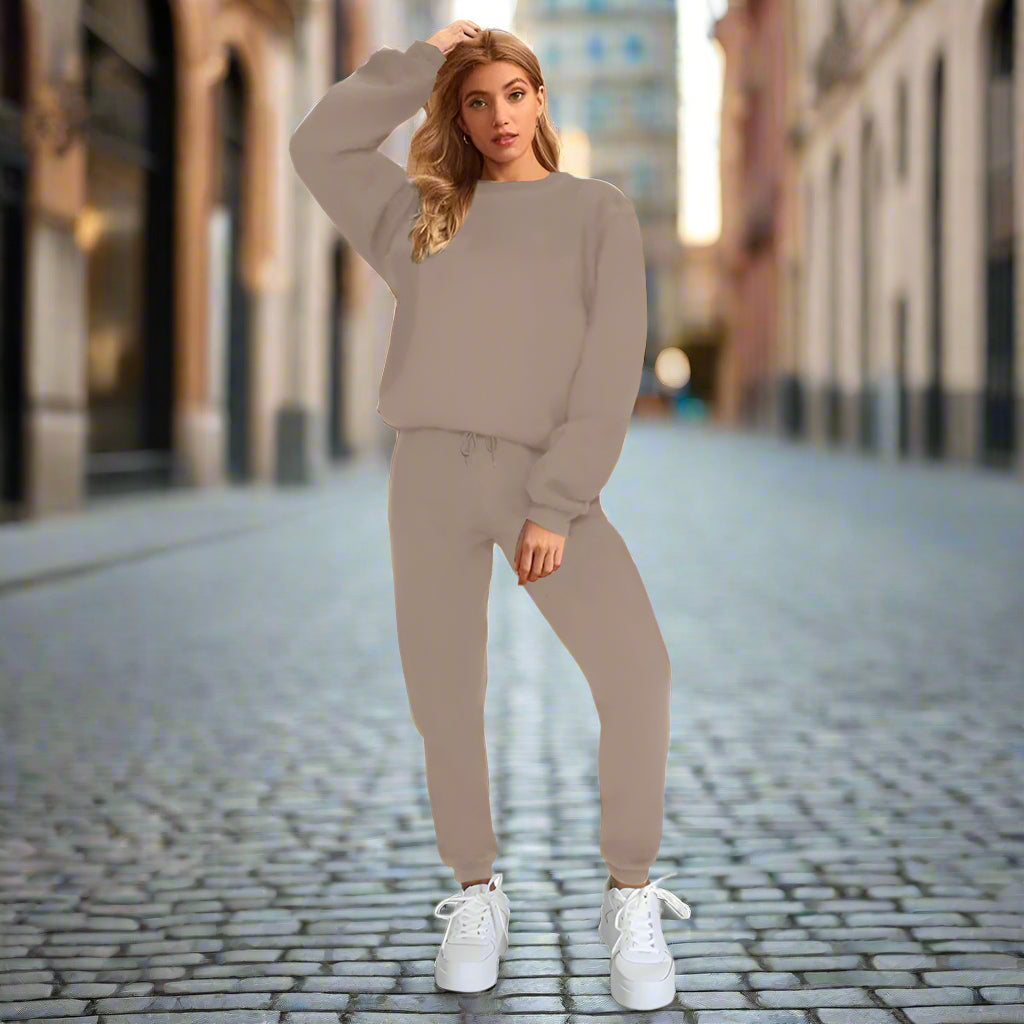 Women's solid color round neck sweatshirt and pants set by Plush Fashion Hub, casualwear with a relaxed fit and comfortable fabric.