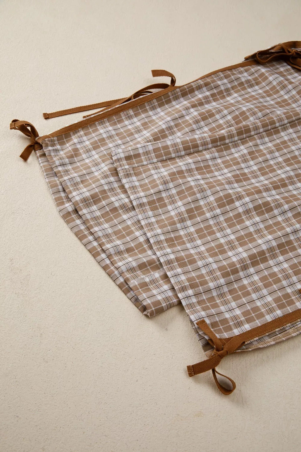 Plaid print casual pants with tie detail by Plush Fashion Hub, featuring a relaxed fit and stylish design.