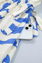 Leafy botanical print maxi dress with side tie and button-down front by Shopimist, shown in a flowing, stylish design.