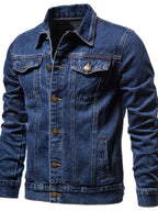 VYSN men's button-down long sleeve denim jacket hanging on a wooden hanger, featuring classic blue denim with chest pockets.