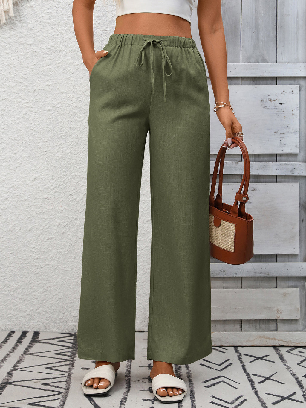 Women's high-waisted wide-leg drawstring pants in soft, breathable viscose fabric, featuring a relaxed fit and comfortable waistband.
