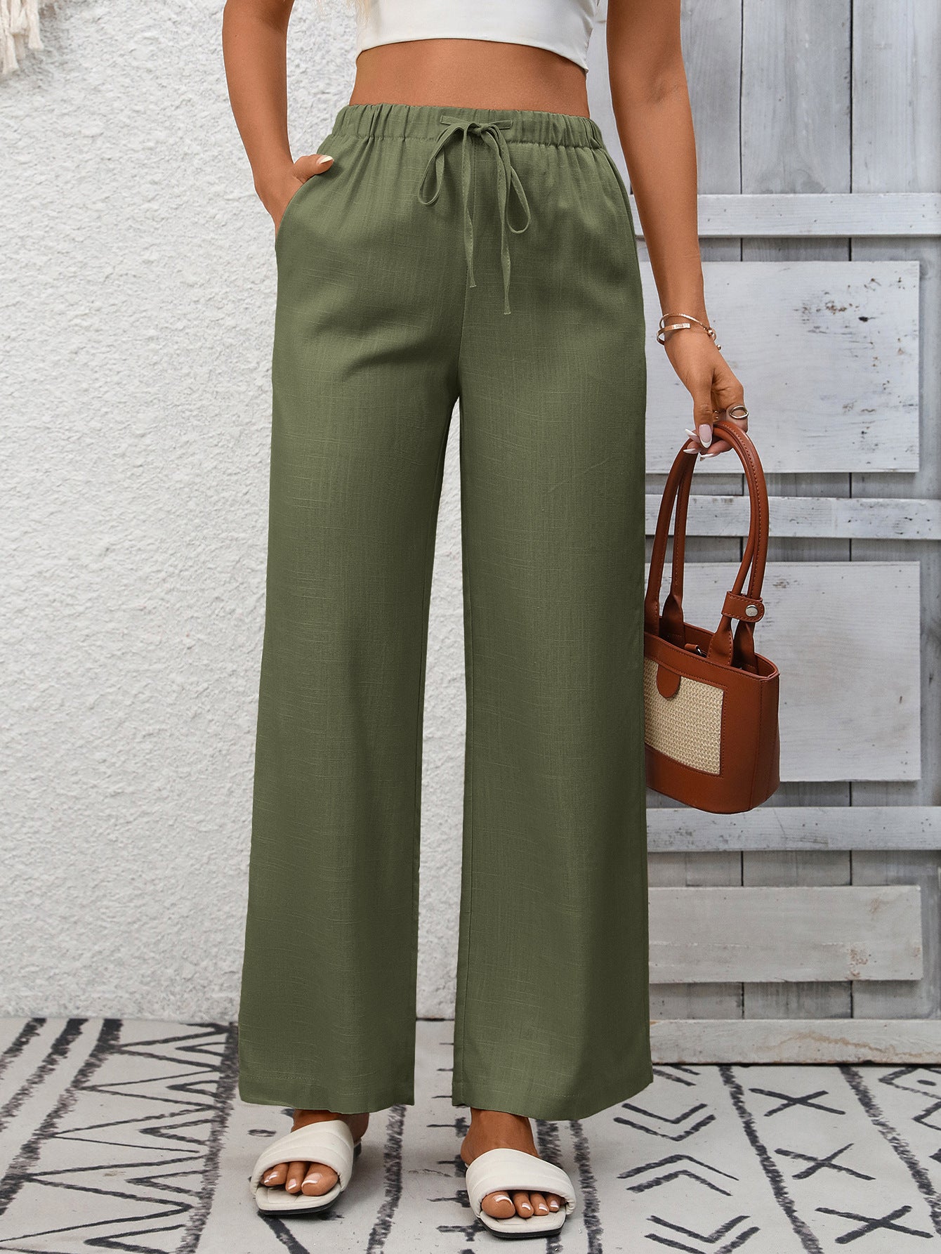 Women's high-waisted wide-leg drawstring pants in soft, breathable viscose fabric, featuring a relaxed fit and comfortable waistband.