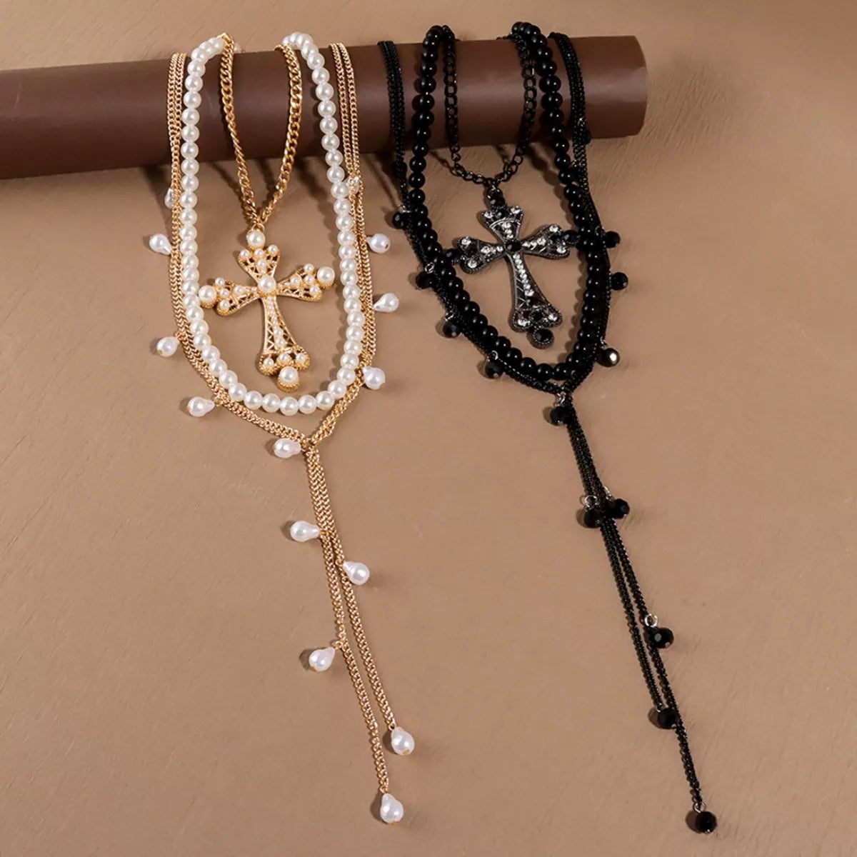 Set of three Pearl Cross Pendant Necklaces by Plush Fashion Hub featuring elegant pearl and cross designs on silver chains.