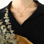 18K gold-plated titanium steel puppy-shaped pendant necklace with detailed dog design on a delicate chain