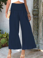 Women's lightweight wide-leg casual pants with smocked waist by Trendsi, featuring a relaxed fit and comfortable fabric.