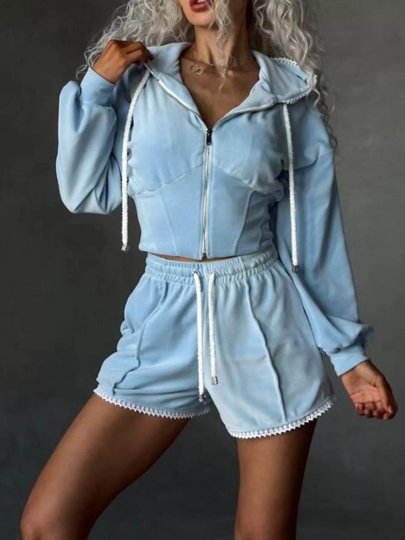 Plush Fashion Hub zip-up hooded outerwear and shorts set, shown in soft fabric with hood, front zipper, and matching shorts.