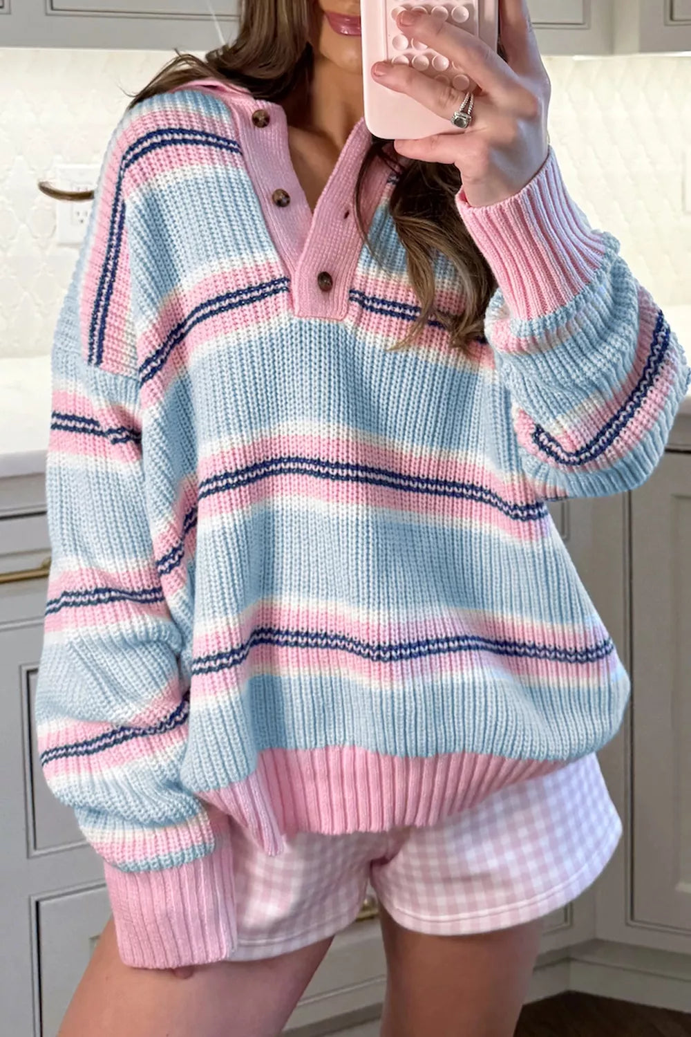 Striped button collar long sleeve knitwear sweater by Trendsi, featuring a cozy design with colorful stripes and a classic collar.