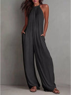 Sleeveless wide-leg jumpsuit by Shopimist featuring a relaxed fit and stylish design, shown on a model in a natural pose.