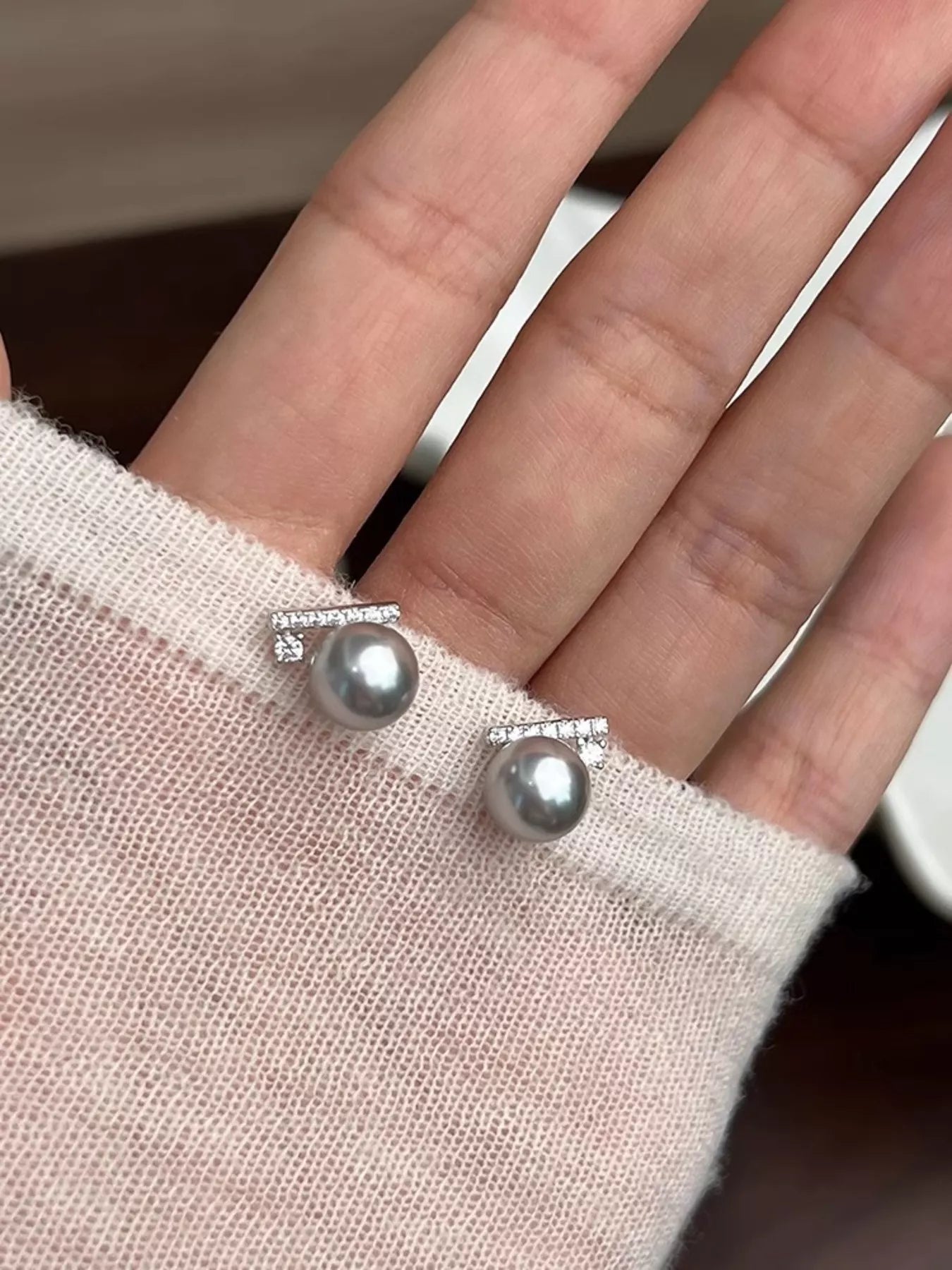 Plush Fashion Hub zircon and pearl stud earrings showcasing elegant jewelry with sparkling zircon stones and lustrous pearls.