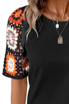 Geometric print round neck short sleeve blouse from Plush Fashion Hub, stylish tops with modern design and vibrant pattern.