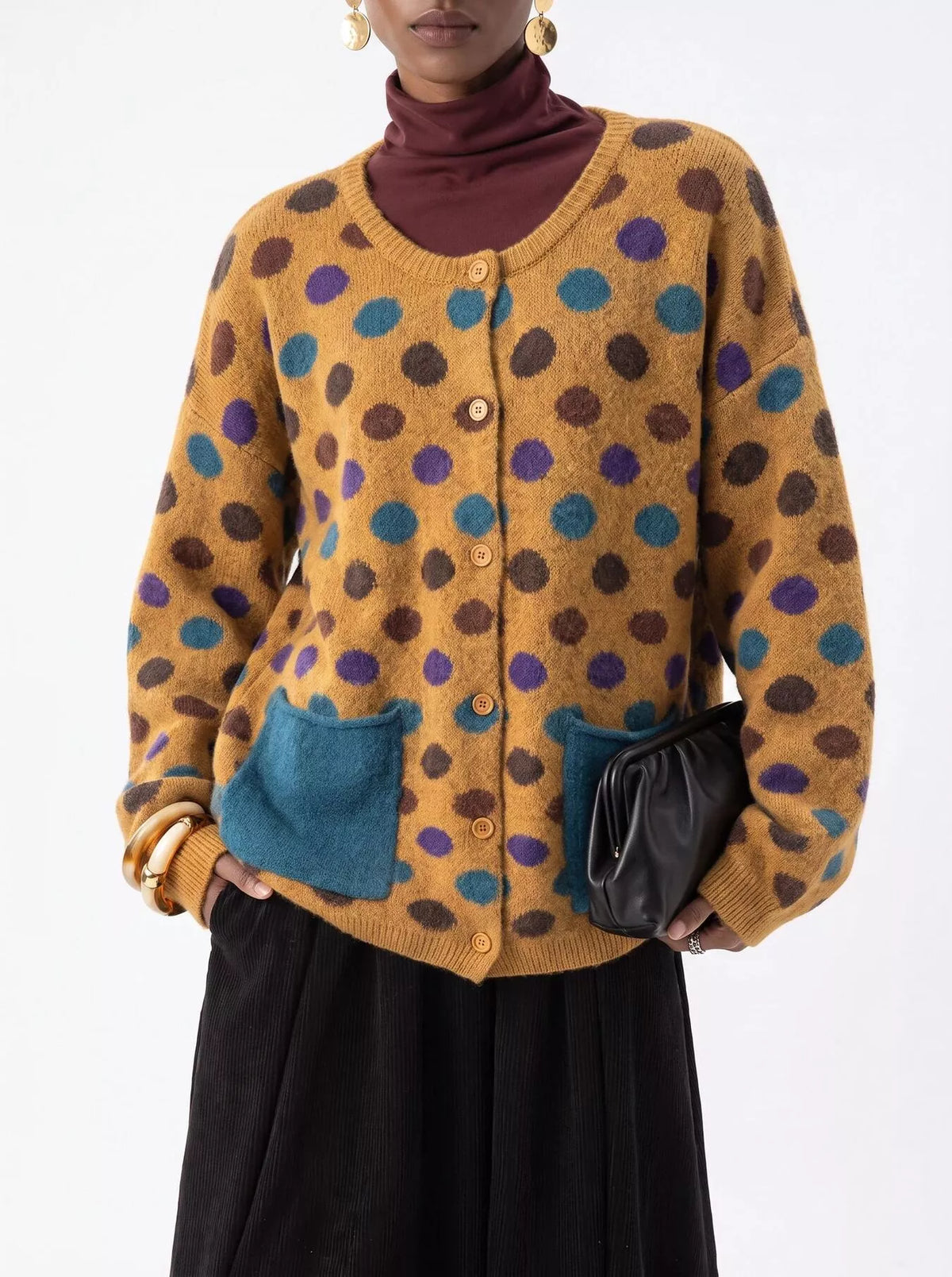 Plus size polka dot button-down cardigan by Trendsi, featuring a full-size fit and classic design, with a cozy knit texture.