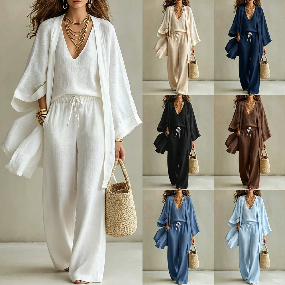 Women's 3-piece cardigan, sleeveless vest, and wide-leg pants matching set by FitiqueFit, styled with layered layers and neutral tones.