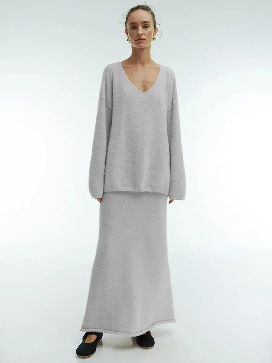 Women’s knitted V-neck sweater and skirt set by eprolo, featuring a warm, casual autumn outfit with thick fabric and stylish pullover design.