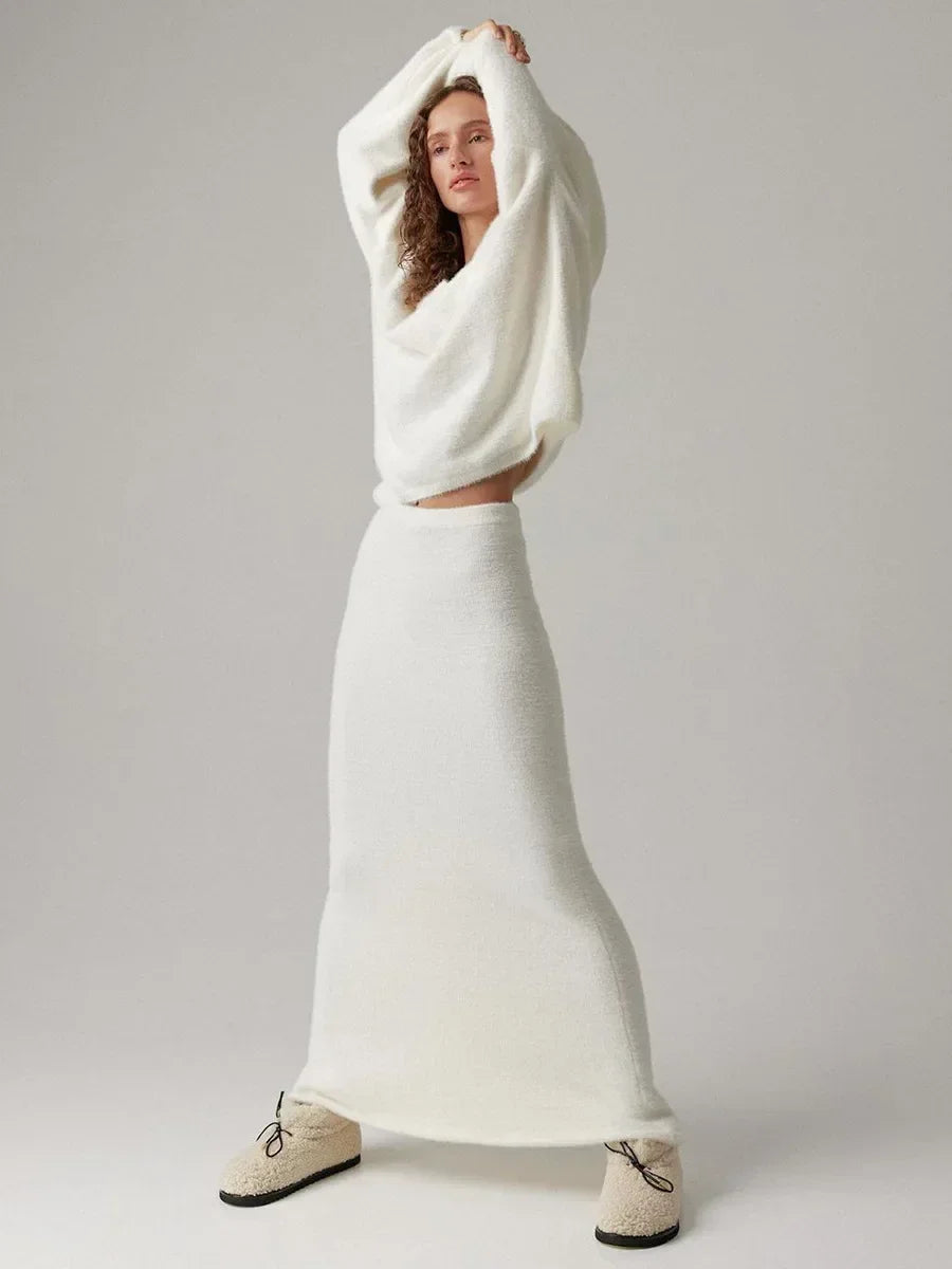 Women’s knitted V-neck sweater and skirt set by eprolo, featuring a warm, casual autumn thick sweater with a coordinating skirt.