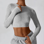 Plush Fashion Hub women's slim fit long sleeve yoga top in activewear, soft fabric, fitted design for comfortable movement.