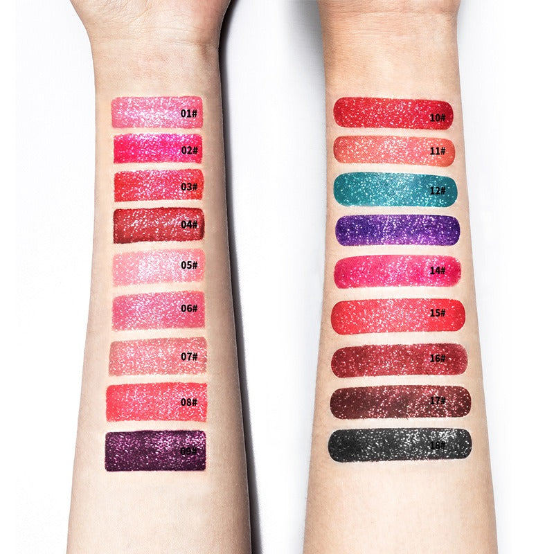 Arm swatches of 18 numbered glitter lipsticks in reds, pinks, blues, purples, and dark shades with sparkly finishes.
