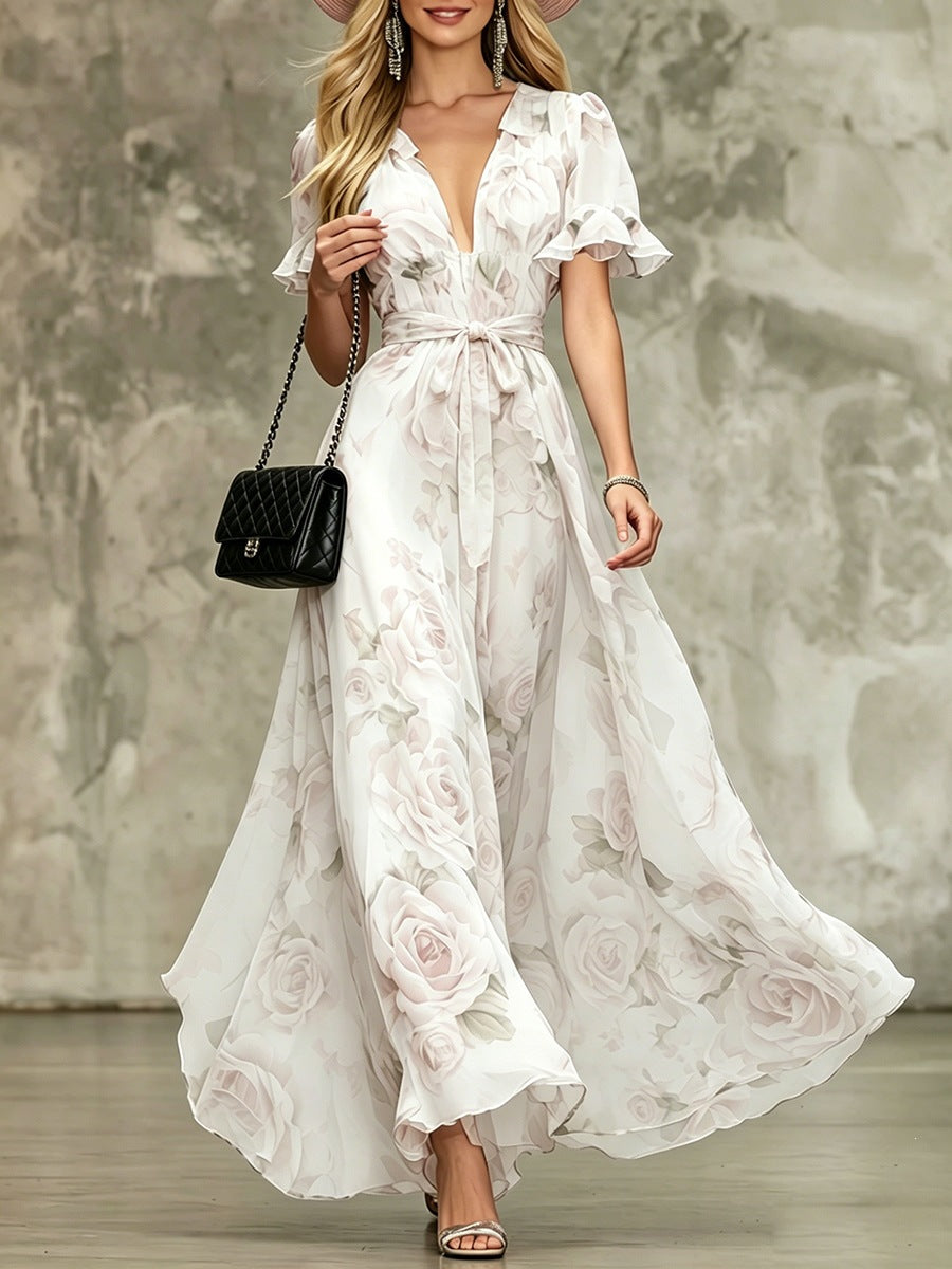 Women's deep V-neck ruffle sleeve printed maxi dress with high waist from Plush Fashion Hub, showcasing flowing fabric and stylish design.