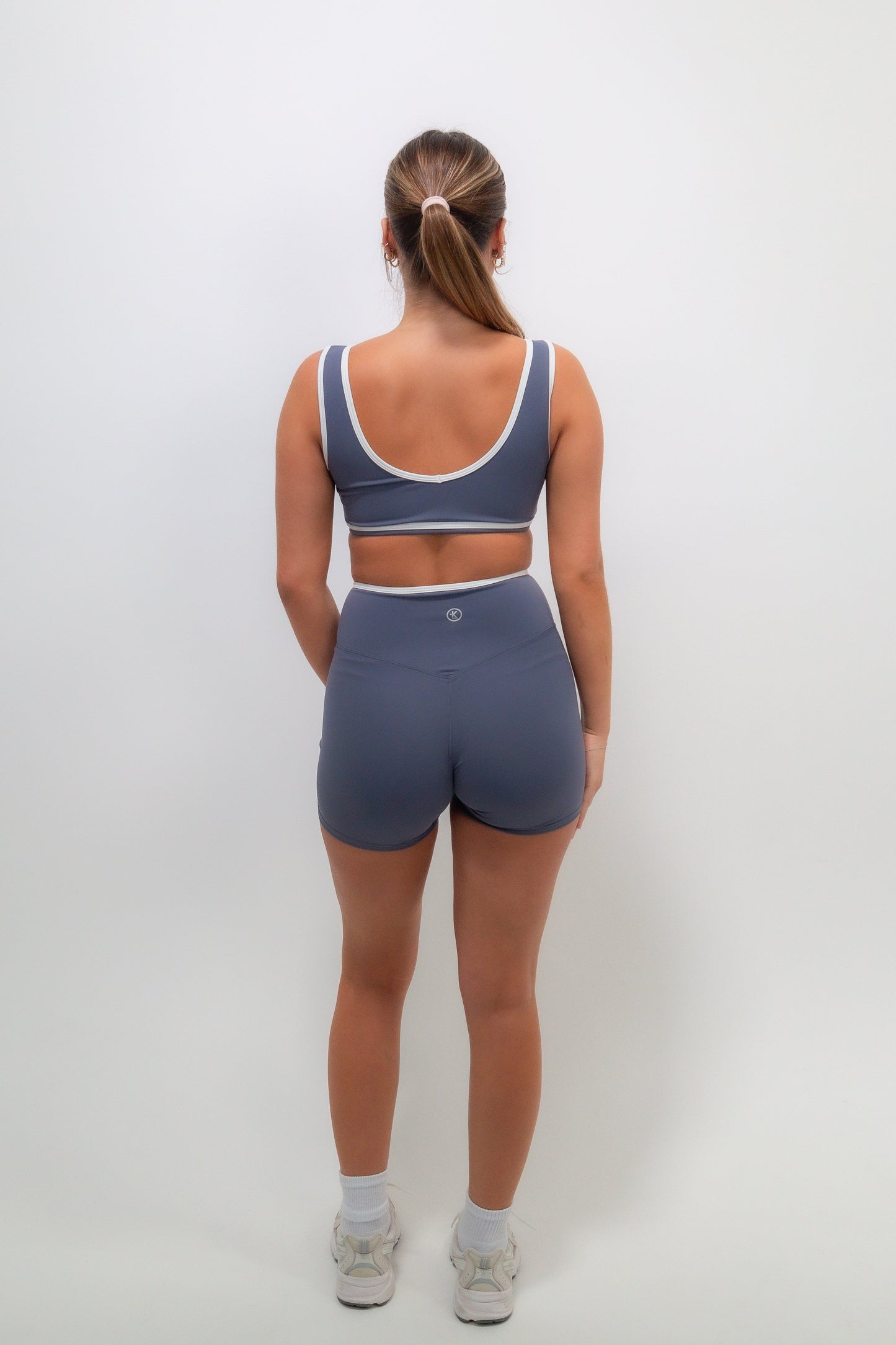 Slate blue butter shorts by KIMITH BRAND featuring a comfortable fit and casual style, shown in a close-up image.