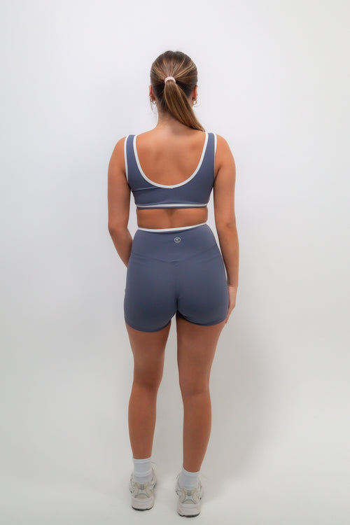Slate blue butter shorts by KIMITH BRAND featuring a comfortable fit and casual style, shown in a close-up image.