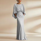 Women's silver backless pleated batwing sleeve maxi dress by FitiqueFit, featuring a mermaid silhouette and elegant design.