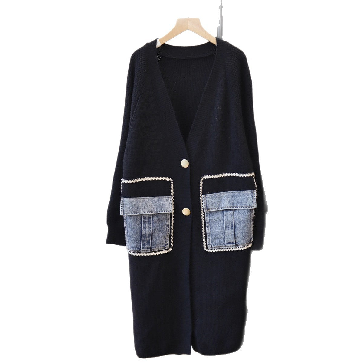 Black knit long cardigan with V-neck, two buttons, and contrasting blue denim flap pockets.