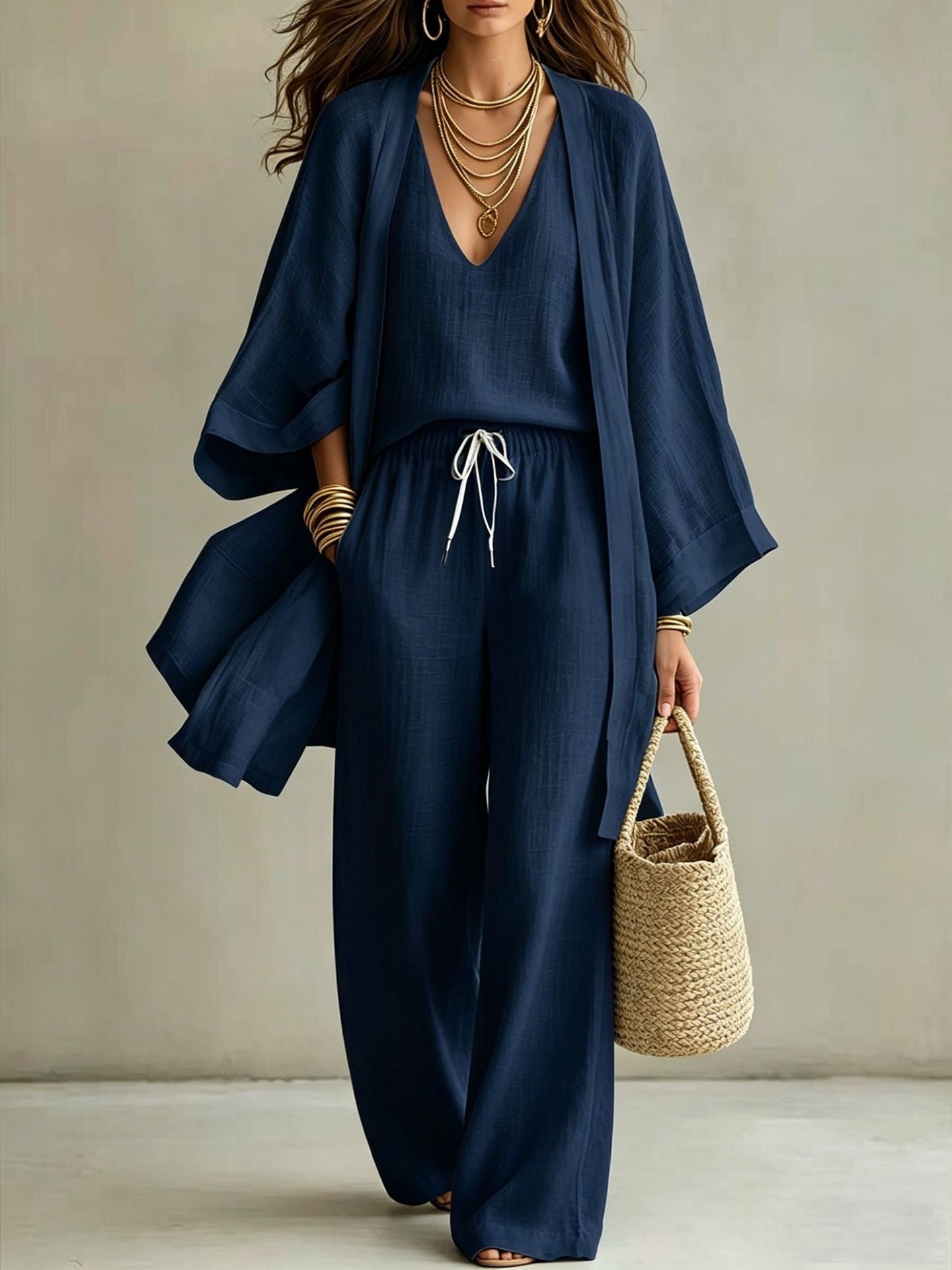 Women's 3-piece cardigan, sleeveless vest, and wide-leg pants matching set by Plush Fashion Hub displayed on a model.