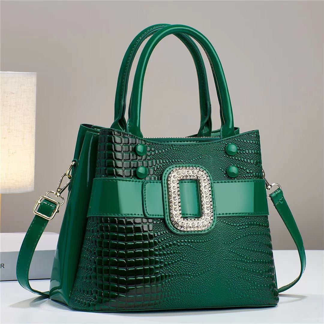 Lizard-patterned mini bucket crossbody bag with zipper from Plush Fashion Hub, featuring a compact design and adjustable strap.